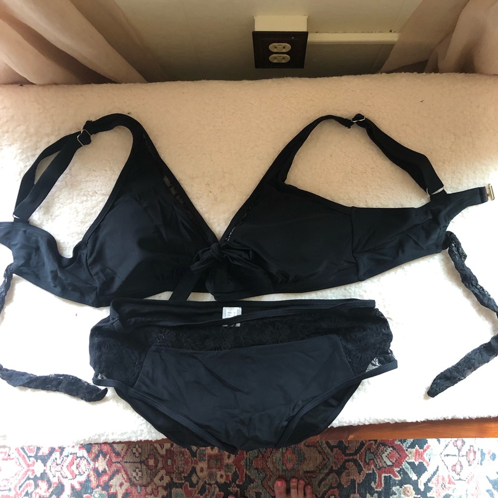 Black 2 piece swimsuit with lace trim on top and bottom